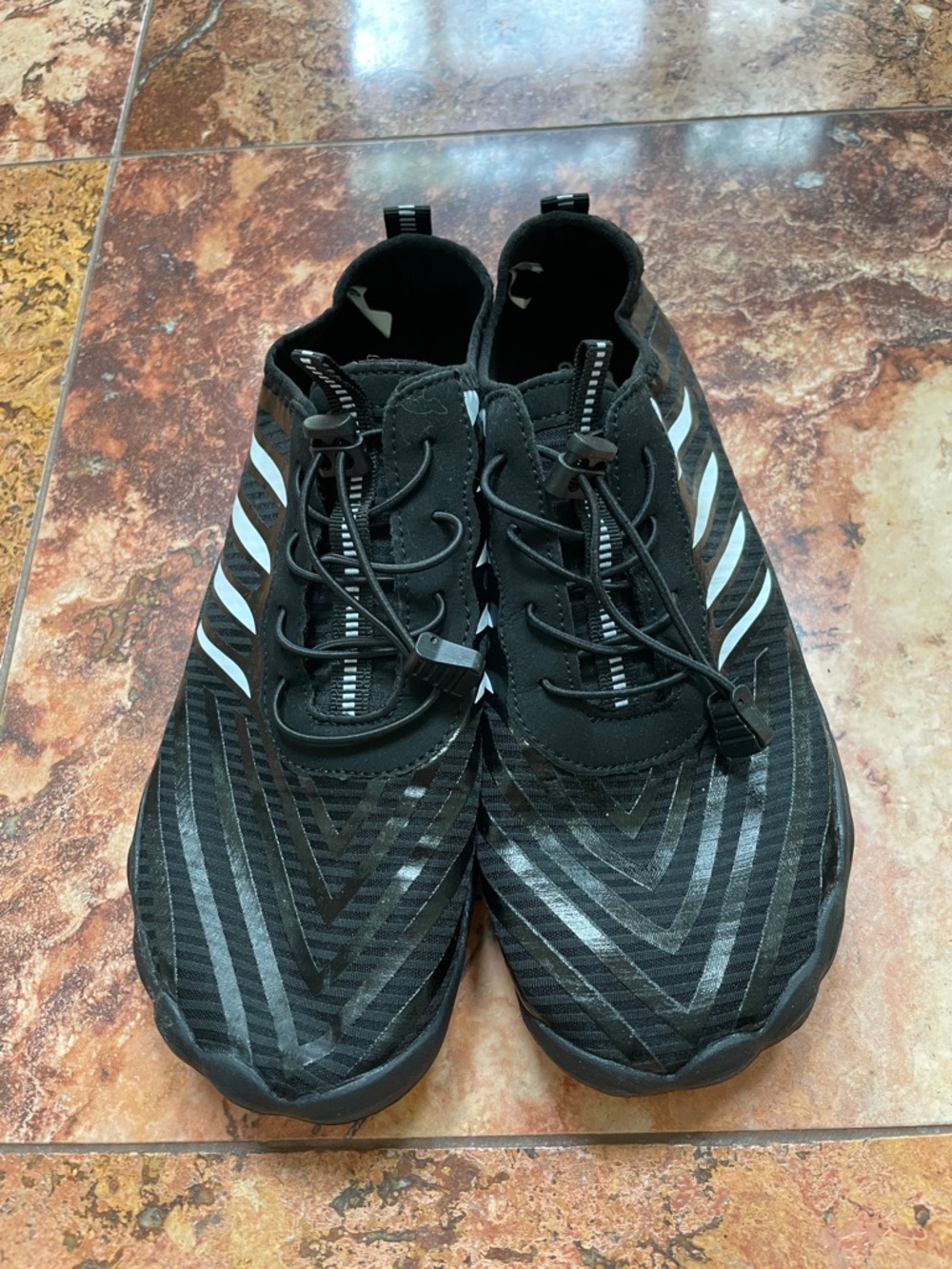 Men's Black Athletic Slip-On Trainers with White Stripe Accents